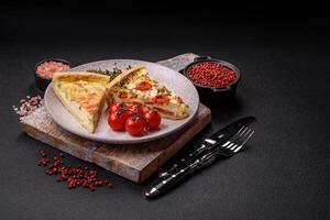 Delicious quiche with broccoli, cheese, chicken, spices and herbs photo