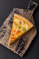 Delicious quiche with broccoli, cheese, chicken, spices and herbs photo