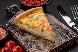 Delicious quiche with broccoli, cheese, chicken, spices and herbs photo