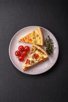 Delicious quiche with broccoli, cheese, chicken, spices and herbs photo