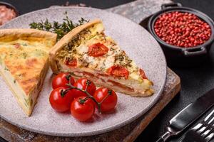 Delicious quiche with broccoli, cheese, chicken, spices and herbs photo