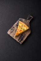 Delicious quiche with broccoli, cheese, chicken, spices and herbs photo