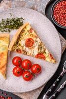 Delicious quiche with broccoli, cheese, chicken, spices and herbs photo