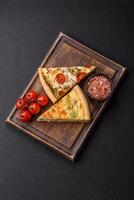 Delicious quiche with broccoli, cheese, chicken, spices and herbs photo