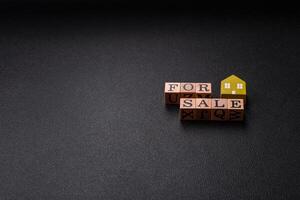 The inscription for sale laid out with wooden cubes photo