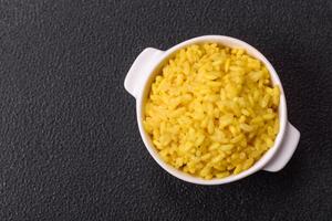 Italian arborio risotto rice with salt, spices and herbs photo