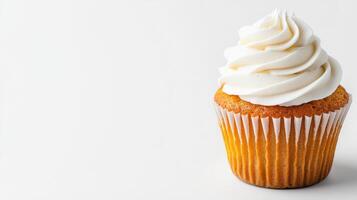 Cupcake with white frosting on a simple background in bright light photo