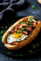 Delicious breakfast sandwich featuring egg and crispy bacon photo