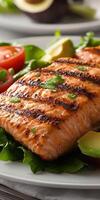 Grilled salmon fillet on a fresh salad with vegetables photo