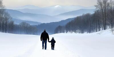 Father and child walking in a snowy landscape in winter photo