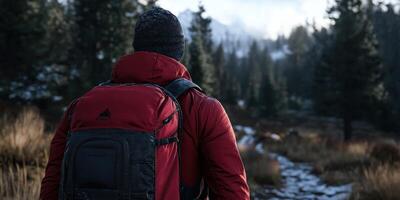 Hiker exploring a scenic mountain trail at sunrise photo