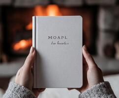 Cozy indoor setting with a journal by the fireplace photo