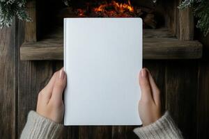 Cozy evening with a blank notebook by the fireplace photo