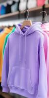 Colorful hoodies displayed in a trendy retail store photo