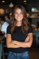 Smiling woman at a busy cafe in a casual setting photo