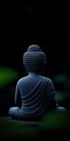 Peaceful Buddha statue in serene setting with dark backdrop photo