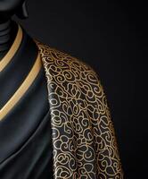 Elegant black and gold fabric draped on a mannequin display photo