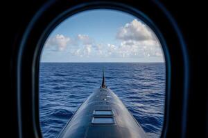 Submarine view over calm ocean waters under blue skies photo