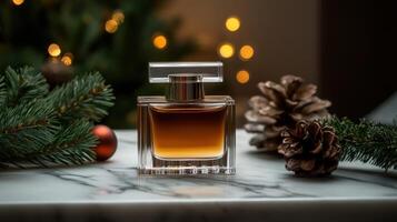 Elegant fragrance bottle on marble with holiday decorations photo