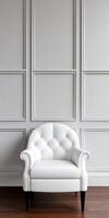 Elegant white chair against a minimalist gray wall photo
