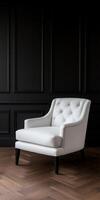 Elegant white armchair against dark wall background photo