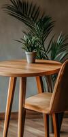 Cozy wooden table setup with a plant and chair photo