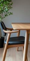 Elegant wooden table and chair set in a modern setting photo