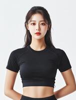 Woman in black athletic wear posing confidently indoors photo