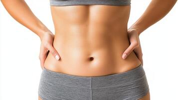 Woman showing toned abdomen in fitness attire during workout photo