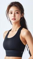 Fitness model showcasing athletic wear in bright studio photo