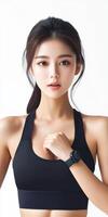 Young woman modeling activewear while showing fitness watch photo