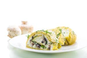 baked potato roll with cottage cheese filling with garlic and mushrooms, isolated on white background photo
