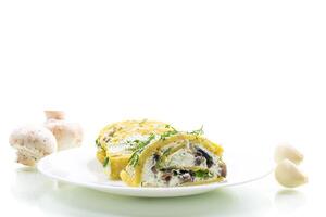 baked potato roll with cottage cheese filling with garlic and mushrooms, isolated on white background photo