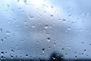 Drops on a window with a beautiful background photo