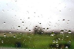 Drops on a window with a beautiful background photo