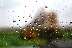 Drops on a window with a beautiful background photo