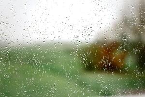 Drops on a window with a beautiful background photo