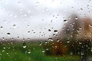 Drops on a window with a beautiful background photo