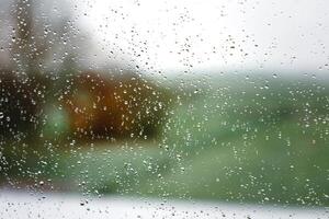 Drops on a window with a beautiful background photo