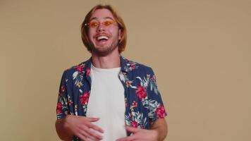 Man demonstrating tongue out, fooling around, making silly playful crazy faces, madness, grimacing video