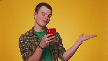 Man using smartphone pointing empty place, advertising area for commercial text, goods promotion video