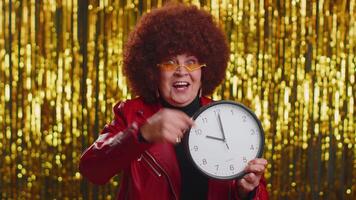 Stylish senior woman showing time on clock watch, ok, thumb up, approve, pointing finger at camera video