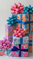 A captivating array of beautifully wrapped gifts in an explosion of colors and patterns, each finished with a grand bow. photo