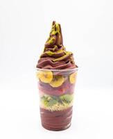 Yogurt and acai ice cream with chopped fruit pieces photo