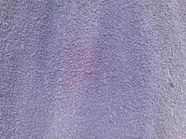 A close-up view of a textured fabric surface with a slightly rough and looped appearance. The material showcases an uneven weave, often used for towels or upholstery photo