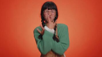 Overjoyed happy woman showing rock n roll gesture by hands, cool sign, shouting yeah with crazy face video