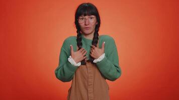 Clueless uncertain doubtful displeased young nerd woman pointing fingers herself, not guilty mistake video