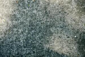 A close up shot of a concrete background, showcasing its textured surface. The neutral tones and rough texture create a modern, industrial aesthetic photo