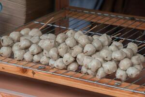A traditional snack from Bandung, Cimol, served at an angkringan. These crispy and chewy snacks are a popular street food enjoyed by many photo