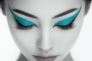 Minimalist Beauty Portrait with Turquoise Winged Eyeliner photo
